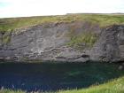 Gull Island Formation with solated turbidite-filled channels and large deformation structures signifying its slope origin.