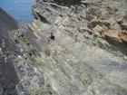 Beds of channelled sands and silty muds of Gull Island Formation whose bedding plane partings have a variety of features on their surfaces including ripples and goniatite fossils.