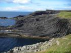 Gull Island Formation with large deformational structures interpreted to have been transported downslope from a deltaic source above.