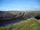 Monocline of Gull Island Formation composed of mixed channel sands and lobes and large deformational structures interpreted to have been transported downslope from a deltaic source above.