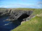 Monocline of Gull Island Formation composed of mixed channel sands and lobes and large deformational structures interpreted to have been transported downslope from a deltaic source above.