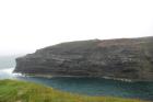 Cliff of Gull Island Formation composed of mixed channel sands and lobes and large deformational structures interpreted to have been transported downslope from a deltaic source above.