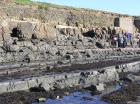 Kilbaha Bay with outcrop of channeled Mid-Ross Sandstone Formation in the low cliffs above the wave cut pavement of the intertidal zone,Note Pleistocene glacial drift at top section filled the Pleistocene eroded surface of the Carboniferous.