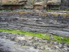 Scouring and soft sediment deformation at the base of the channeled sand lobes of the Ross Formation on the West side of Kilbaha Bay