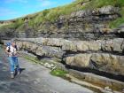 At base of section to center of section is a megaflute in the Ross Formation on the West side of Kilbaha Bay. At top of section are interbedded amalgamated sands of deepwater channeled sand lobes and overbank shales..