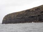 Kilclogher Cliffs exposing deepwater sandstone lobes of the Ross Formation. In the section below are thinner bedded more distal portions of lobes while above are thicker bedded sands towards axies of the lobes.