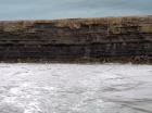 Kilclogher Cliffs exposing deepwater sandstone lobes of the Ross Formation. In the section below are thinner bedded more distal portions of lobes while above are thicker bedded sands towards axies of the lobes.