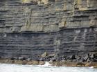 Kilclogher Cliffs exposing deepwater sandstone lobes of the Ross Formation. In the section below are thinner bedded more distal portions of lobes while above are thicker bedded sands towards axies of the lobes.