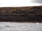Kilclogher Cliffs exposing deepwater sandstone lobes of the Ross Formation. In the section below are thinner bedded more distal portions of lobes while above are thicker bedded sands towards axies of the lobes.