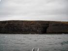 Kilclogher Cliffs exposing deepwater sandstone lobes of the Ross Formation. In the section below the base is a thicker amalgamated sand of a deepwater lobe but immediately above but in the lower section are thinner bedded more distal portions of lobes while above are thicker bedded sands more proximal to the axies of deepwater lobes.