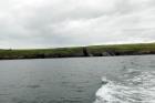 Between Kilclogher and Rehy Cliffs are exposures of the deepwater sandstone lobes of the Ross Formation. Thicker bedded amalgamated channeled sands represent the proximal axies of deepwater lobes interbedded with lobe and channel wing sands. A monocline is to right.