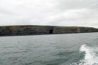 East end of the Kilclogher Cliffs exposing deepwater sandstone lobes of the Ross Formation. At the base of the section are thinner bedded more distal portions of lobes. Above in grass cover to right and in the exposure to the left are thicker bedded amalgamated channeled sands more proximal to the axies of deepwater lobes.