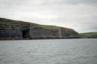 Kilclogher Cliffs exposing deepwater sandstone lobes of the Ross Formation. At the base of the section are thinner bedded more distal portions of lobes subdivided by a thicker bedded amalgamated channeled sand. At the top of the section arto the left are thicker bedded amalgamated channeled sands more proximal to the axies of deepwater lobes. To the east are the Rehy Cliffs.