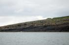 Kilclogher Cliffs exposing deepwater sandstone lobes of the Ross Formation. In the section below are thinner bedded more distal portions of lobes while above are thicker bedded sands towards axies of the lobes. Note the generation of some amalgamated axial channel fill expected close to the middle of a deepwater lobe.