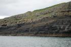 Kilclogher Cliffs exposing deepwater sandstone lobes of the Ross Formation. In the section below are thinner bedded more distal portions of lobes while above are thicker bedded sands towards axies of the lobes. Note the generation of some amalgamated axial channel fill that would be expected close to the middle of lobe.
