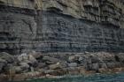 Kilclogher Cliffs exposing deepwater sandstone lobes of the Ross Formation. At the base of the section is an amalgamated axial channel fill. Above which are thinner bedded more distal portions of lobes capped by thicker bedded sands towards axies of the lobes.