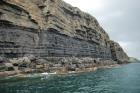 Kilclogher Cliffs exposing deepwater sandstone lobes of the Ross Formation. At the base of the section is an amalgamated axial channel fill. Above which are thinner bedded more distal portions of lobes capped by thicker bedded sands towards axies of the lobes.