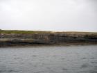 Kilcredaun Cliffs in the vicinity of the Kilcredaun lighthouse. Outcropping in these cliffs are thin bedded turbidite channel fill and turbidite sand lobes in the Upper Carboniferous Namurian Ross Formation. Photographs taken from the fishing vessel Draiocht out of Carrigaholt on the northern shore of the Shannon Estuary.