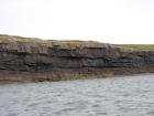 Kilcredaun Cliffs exposing thin bedded turbidite channel fill and turbidite sand lobes in the Upper Carboniferous Namurian Ross Formation. Photographs taken from the fishing vessel Draiocht out of Carrigaholt on the northern shore of the Shannon Estuary.