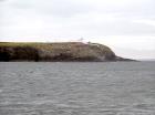 Kilcredaun Cliffs in the vicinity of the Kilcredaun lighthouse. Outcropping in these cliffs are thin bedded turbidite channel fill and turbidite sand lobes in the Upper Carboniferous Namurian Ross Formation. Photographs taken from the fishing vessel Draiocht out of Carrigaholt on the northern shore of the Shannon Estuary.