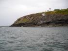 Kilcredaun Cliffs in the vicinity of the Kilcredaun lighthouse. Outcropping in these cliffs are thin bedded turbidite channel fill and turbidite sand lobes in the Upper Carboniferous Namurian Ross Formation. Photographs taken from the fishing vessel Draiocht out of Carrigaholt on the northern shore of the Shannon Estuary.