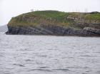 Kilcredaun Cliffs in the vicinity of the Kilcredaun lighthouse. Outcropping in these cliffs are thin bedded turbidite channel fill and turbidite sand lobes in the Upper Carboniferous Namurian Ross Formation. Photographs taken from the fishing vessel Draiocht out of Carrigaholt on the northern shore of the Shannon Estuary.