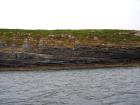 Kilcredaun Cliffs in the vicinity of the Kilcredaun lighthouse. Outcropping in these cliffs are thin bedded turbidite channel fill and turbidite sand lobes in the Upper Carboniferous Namurian Ross Formation. Photographs taken from the fishing vessel Draiocht out of Carrigaholt on the northern shore of the Shannon Estuary.