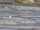 Kilcredaun Cliffs in the vicinity of the Kilcredaun lighthouse. On land and close up images of flazer structures and small slumps in thin bedded turbidite overbank and channel fill in the Upper Carboniferous Namurian Ross Formation. Photographs taken by Chistopher kendall and Peter Haughton on the wave cut ledges of northern shore of the Shannon Estuary.