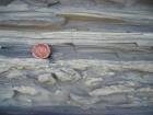 Kilcredaun Cliffs in the vicinity of the Kilcredaun lighthouse. On land and close up images of sediments in these cliffs show thin bedded turbidite channel fill and turbidite sand lobes in the Upper Carboniferous Namurian Ross Formation. Photographs taken by Chistopher kendall and Peter Haughton on the wave cut ledges of northern shore of the Shannon Estuary.