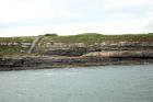 Kilcredaun Cliffs in the vicinity of the Kilcredaun lighthouse. Outcropping in these cliffs are thin bedded turbidite channel fill and turbidite sand lobes in the Upper Carboniferous Namurian Ross Formation. Photographs taken from the fishing vessel Draiocht out of Carrigaholt on the northern shore of the Shannon Estuary.