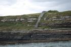 Kilcredaun Cliffs in the vicinity of the Kilcredaun lighthouse. Outcropping in these cliffs are thin bedded turbidite channel fill and turbidite sand lobes in the Upper Carboniferous Namurian Ross Formation. Photographs taken from the fishing vessel Draiocht out of Carrigaholt on the northern shore of the Shannon Estuary.