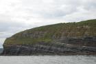 Kilcredaun Cliffs in the vicinity of the Kilcredaun lighthouse. Outcropping in these cliffs are thin bedded turbidite channel fill and turbidite sand lobes in the Upper Carboniferous Namurian Ross Formation. Photographs taken from the fishing vessel Draiocht out of Carrigaholt on the northern shore of the Shannon Estuary.