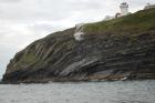 Kilcredaun Cliffs in the vicinity of the Kilcredaun lighthouse. Outcropping in these cliffs are thin bedded turbidite channel fill and turbidite sand lobes in the Upper Carboniferous Namurian Ross Formation. Photographs taken from the fishing vessel Draiocht out of Carrigaholt on the northern shore of the Shannon Estuary.