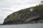 Kilcredaun Cliffs in the vicinity of the Kilcredaun lighthouse. Outcropping in these cliffs are thin bedded turbidite channel fill and turbidite sand lobes in the Upper Carboniferous Namurian Ross Formation. Photographs taken from the fishing vessel Draiocht out of Carrigaholt on the northern shore of the Shannon Estuary.