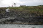 Kilcredaun Cliffs in the vicinity of the Kilcredaun lighthouse. Outcropping in these cliffs are thin bedded turbidite channel fill and turbidite sand lobes in the Upper Carboniferous Namurian Ross Formation. Photographs taken from the fishing vessel Draiocht out of Carrigaholt on the northern shore of the Shannon Estuary.