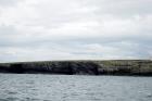 Kilcredaun Cliffs in the vicinity of the Kilcredaun lighthouse. Outcropping in these cliffs are thin bedded turbidite channel fill and turbidite sand lobes in the Upper Carboniferous Namurian Ross Formation. Photographs taken from the fishing vessel Draiocht out of Carrigaholt on the northern shore of the Shannon Estuary.