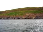 Rehy Cliffs two offset but stacked deepwater channels. Morphology and frequency suggest a mid turbidite fan position for these Ross Sands. These lower sandbodies are erosionally amalgamated and show wing like extension into finer sediment.