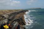 Western Rinevilla Point wave cut platform outcrops of Namurian Ross Formation. Overview of inclined turbidite channel margin fill sheet sands.