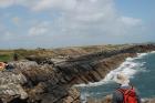 Western Rinevilla Point wave cut platform outcrops of Namurian Ross Formation. Overview of inclined turbidite channel margin fill sheet sands.