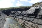 Western Rinevilla Point wave cut platform outcrops of Namurian Ross Formation. Note thin deepwater turbidite channel fill sheet sands of fan lobes.