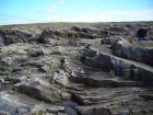 Tullig Formation channel fill sands of Upper Carboniferous or Namurian age. Channeling and sorting of the quartz rich character of the sands of the delta front reflect waves impinging on the delta front sands that filled distributary channels and/or proximal bar sands (Andy Pulham personal communication and Martinsen et al., 2008).