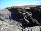 Rhymically bedded silts and muds at and below wave base in the Tulllig Formation.