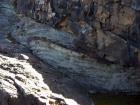 Slumping and soft sedimentary deformation channel fill sands of Upper Carboniferous or Namurian aged sands (Andy Pulham personal communication and Martinsen et al., 2008). Located in the Trusklieve cliff top amphitheatre.