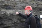 Base of cliffed amphitheatre on south side of Trusklieve wave eroded cliff margin slot exposes rhythmic alternations of silt, sand and mud that accumulated just above wave base (Andy Pulham personal communication and Martinsen et al., 2008). Section is portion of Tullig Formation Upper Carboniferous or Namurian age delta front.