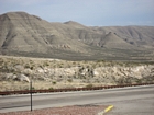 Photo from close to the base of the El Capitan Reef . Distant view of mainly of interfingering mixed slope materials which are mainly by passing Brushy Canyon clastics that underlie the Capitan Limestone Reef.