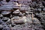 Toe of slope of Capitan Limeston margin expressed by varve like organic-rich Larmar limestones interbedded with siltier limestones. By pass fill of basin during highstands in sea level. Hwy 62-180 west of New Mexico West Texas border.